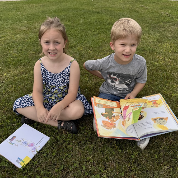 Reading fun outside at OES! #everykid #redridernation