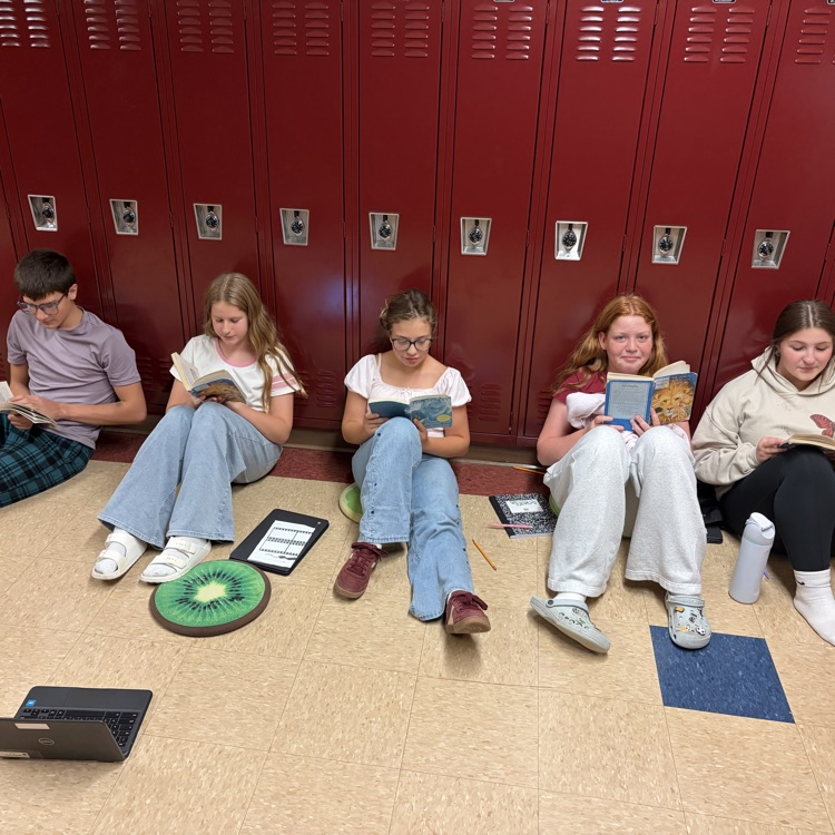 📚 Getting lost in a good book at OMS! ❤️🖤