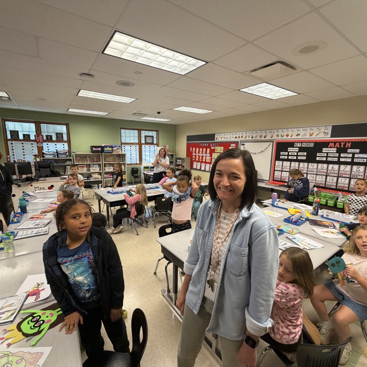 Mrs. Besancon & her high school class helping our second graders with making monsters