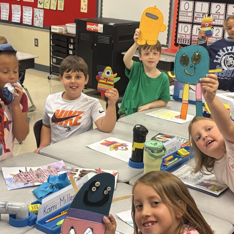 Mrs. Besancon & her high school class helping our second graders with making monsters
