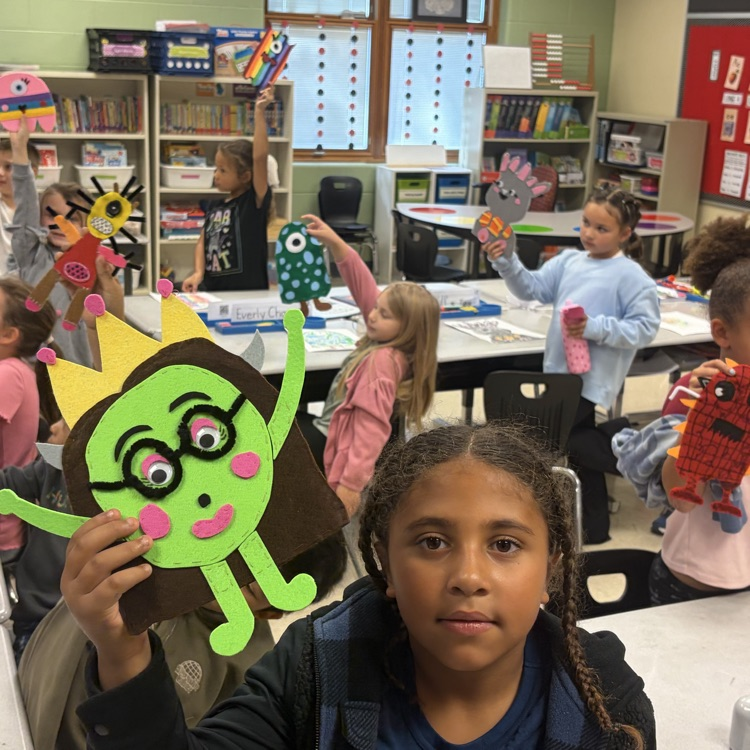 Mrs. Besancon & her high school class helping our second graders with making monsters