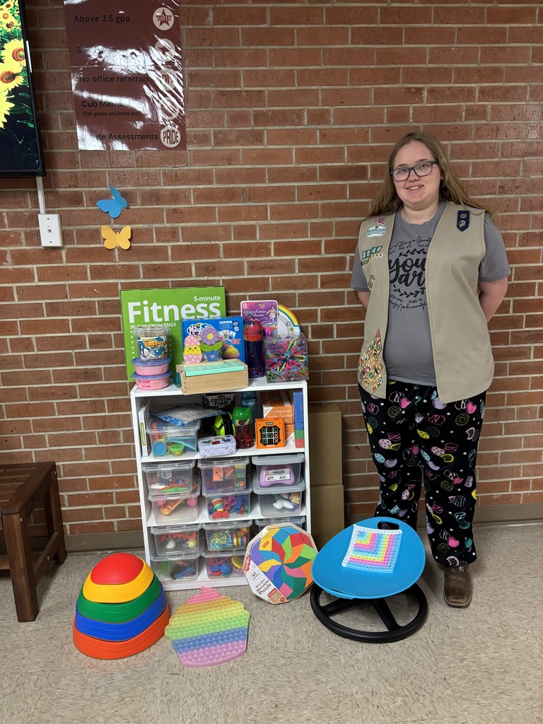 Jozlynn with donated sensory toys and tools 