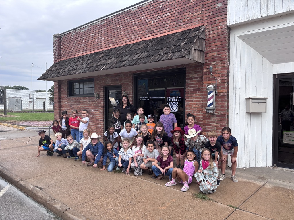 2nd Graders outside Osage City Garden and Produce