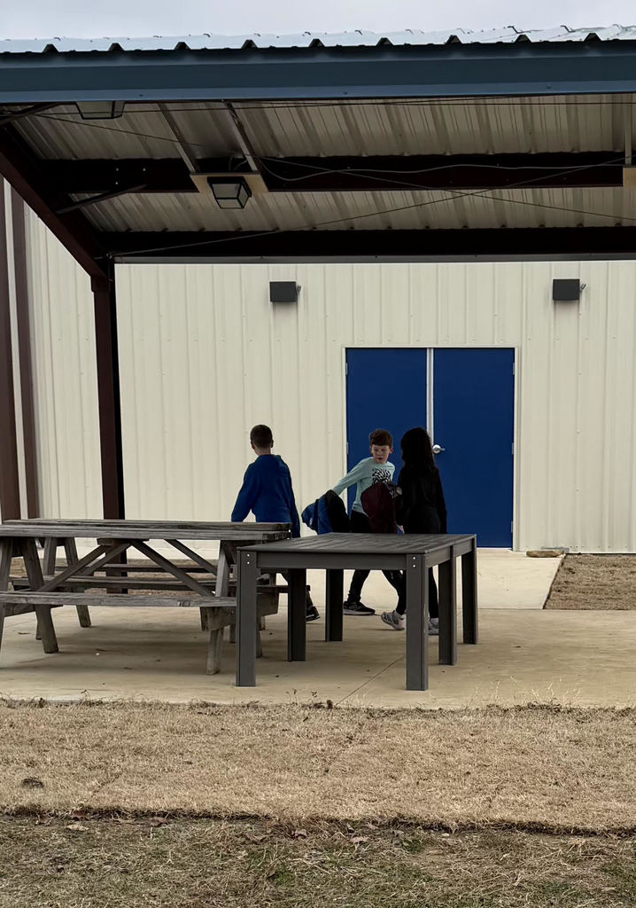 Students doing a scavenger hunt on the playground.
