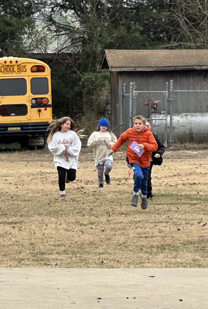 Students running on the playground.