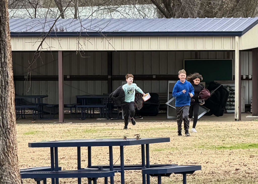 Students running on the playground.