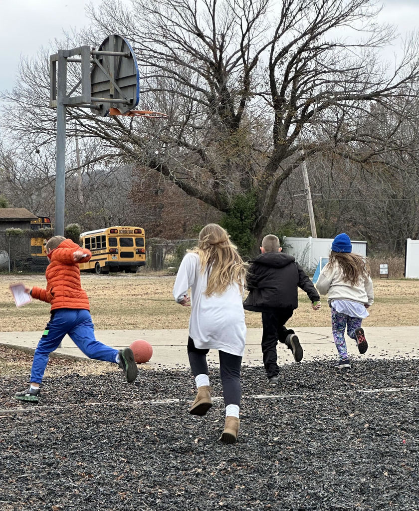 Students running on the playground.