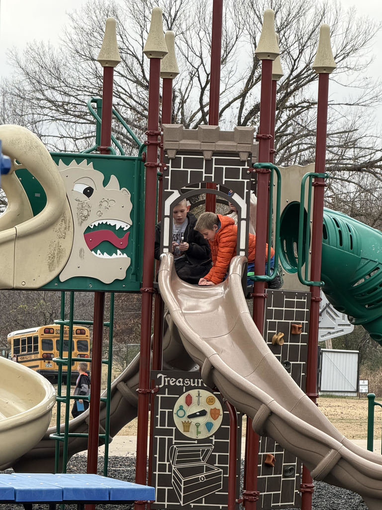 Students solving math problems on the playground.