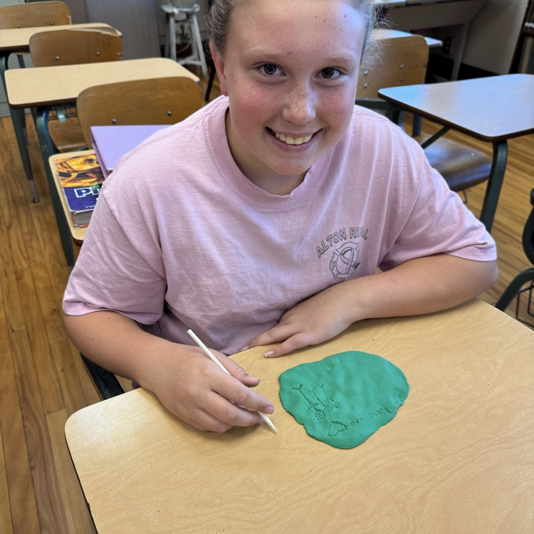 After learning about cuneiform in ancient Mesopotamia, 6th grade Social Studies students created their own messages by carving into clay, similar to how the ancient Sumerian scribes once did.