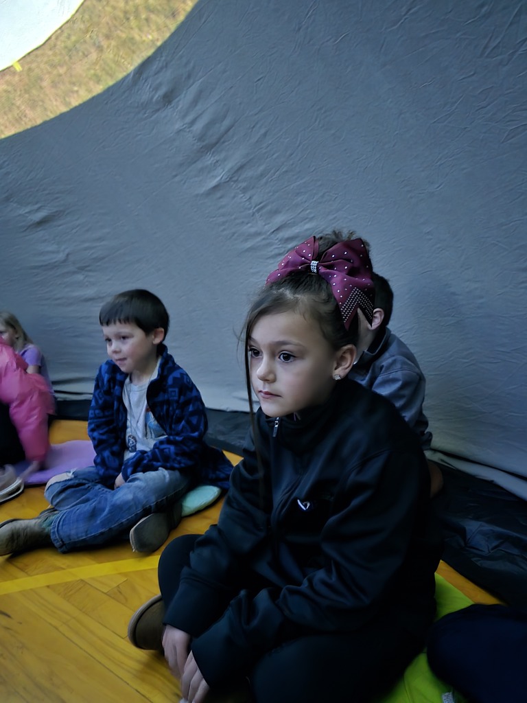 Mrs. Carlin and Mrs. Schultz's kindergarteners enjoying the traveling planetarium. 