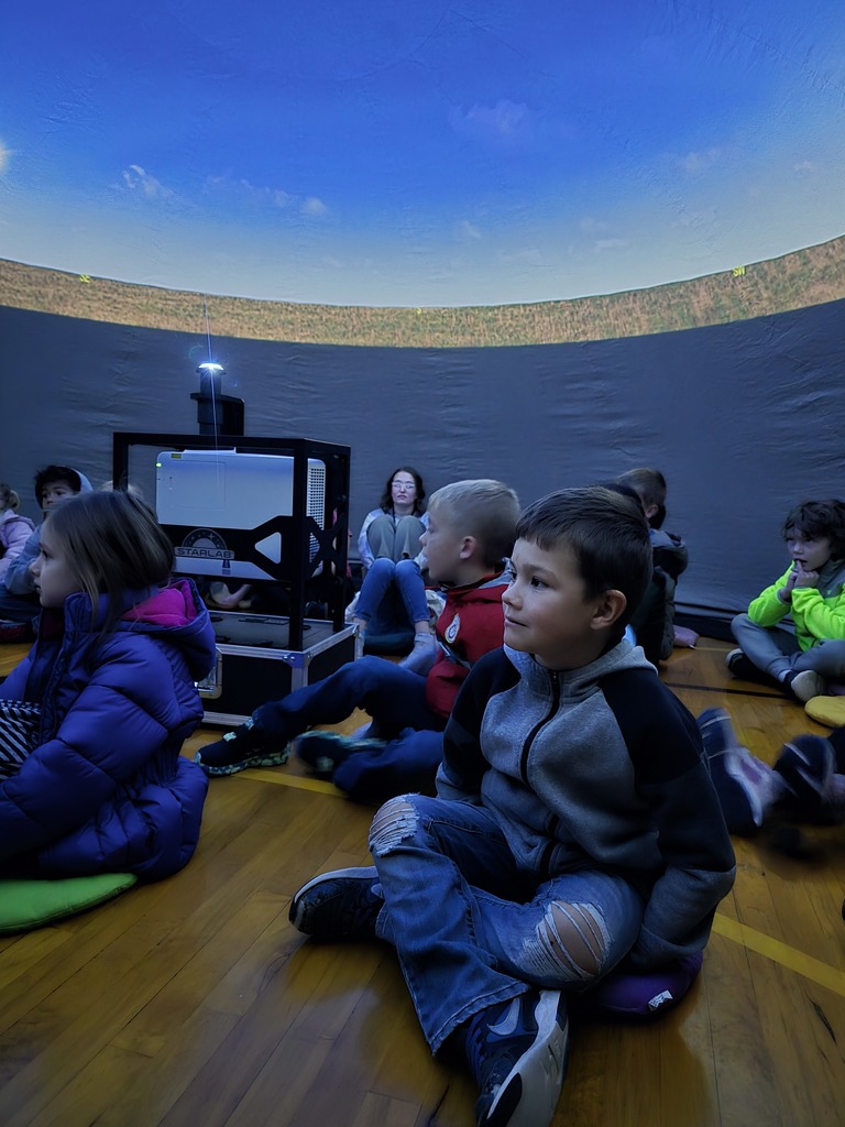 Mrs. Carlin and Mrs. Schultz's kindergarteners enjoying the traveling planetarium. 