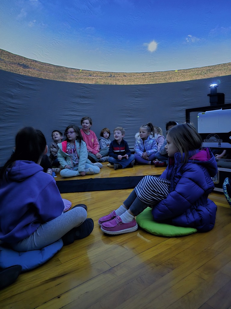 Mrs. Carlin and Mrs. Schultz's kindergarteners enjoying the traveling planetarium. 
