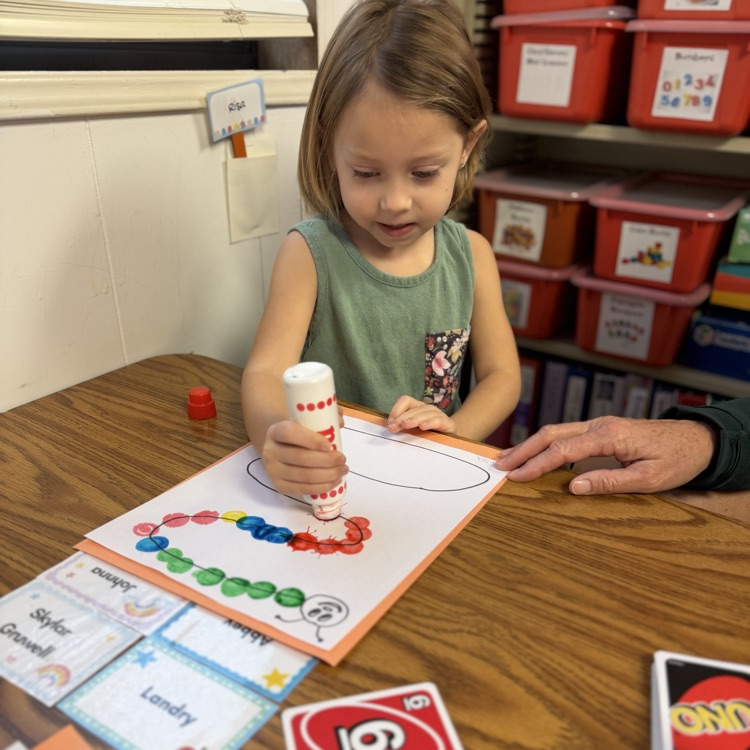 AM Preschool working on their fine motor skills.