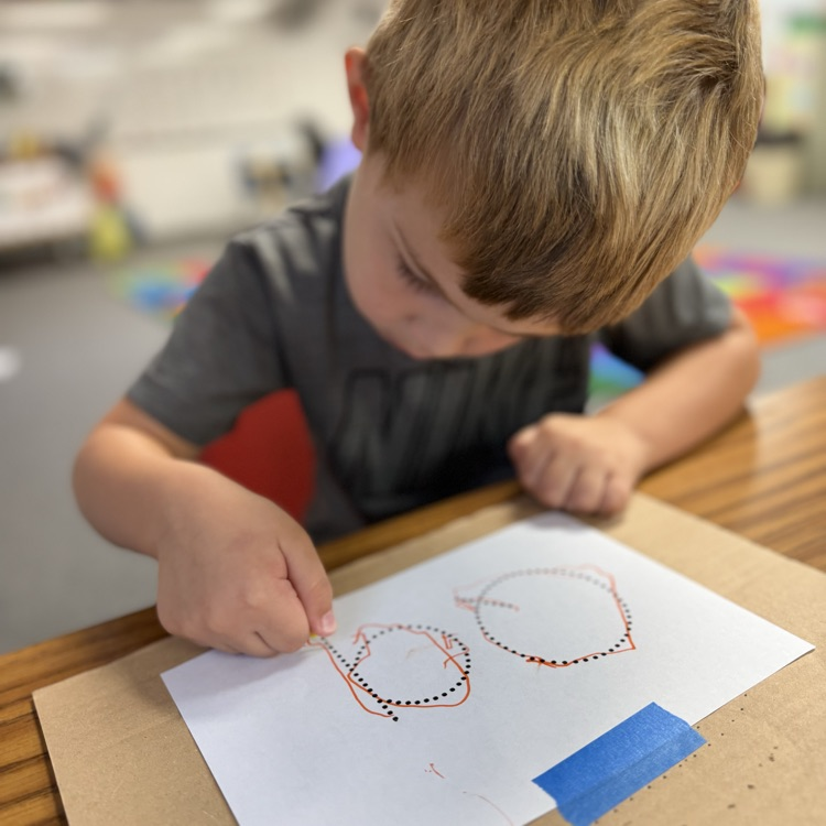 AM Preschool working on their fine motor skills.