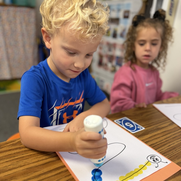 AM Preschool working on their fine motor skills.