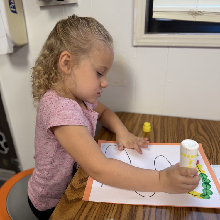 AM Preschool working on their fine motor skills.