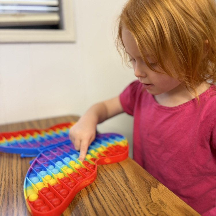 AM Preschool working on their fine motor skills.