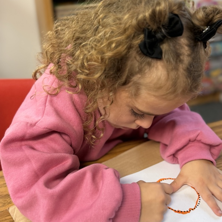 AM Preschool working on their fine motor skills.