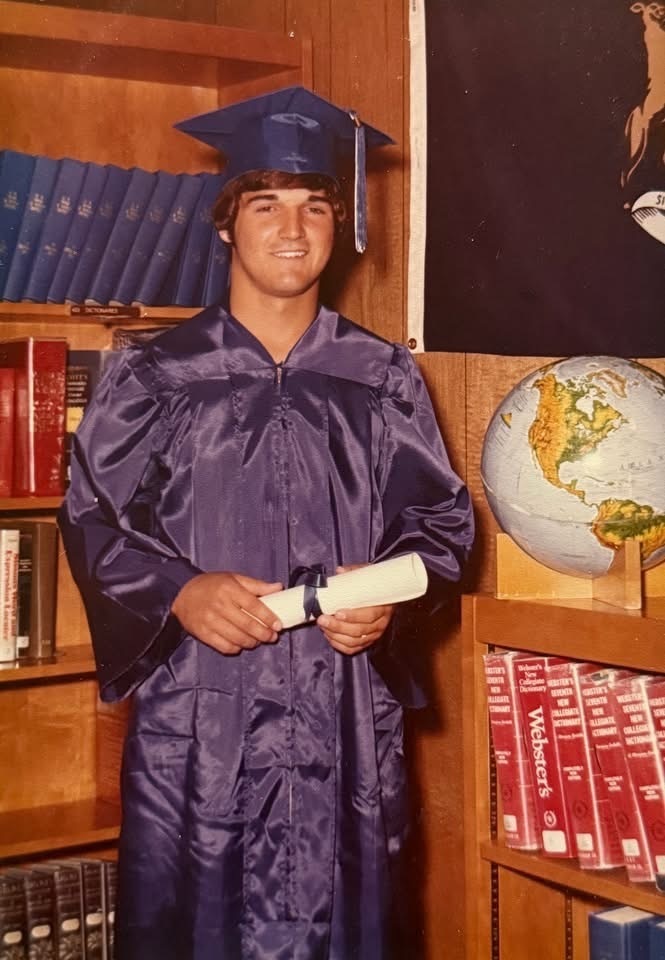 The image shows Hall of Fame inductee, Rick Beck at his graduation.