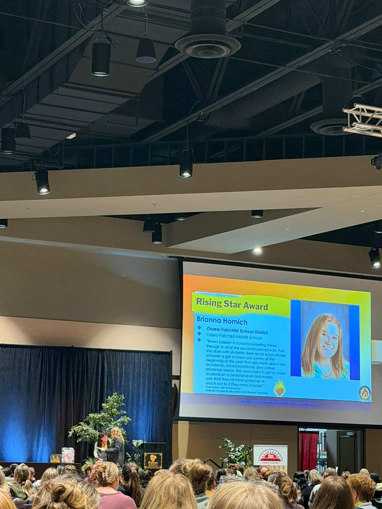 Ms. Homich receiving award