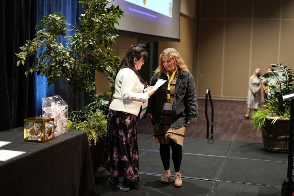 Ms. Homich receiving award