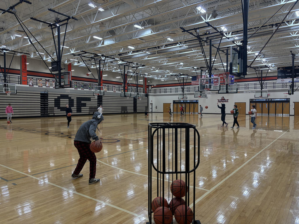 boys playing basketball in gym