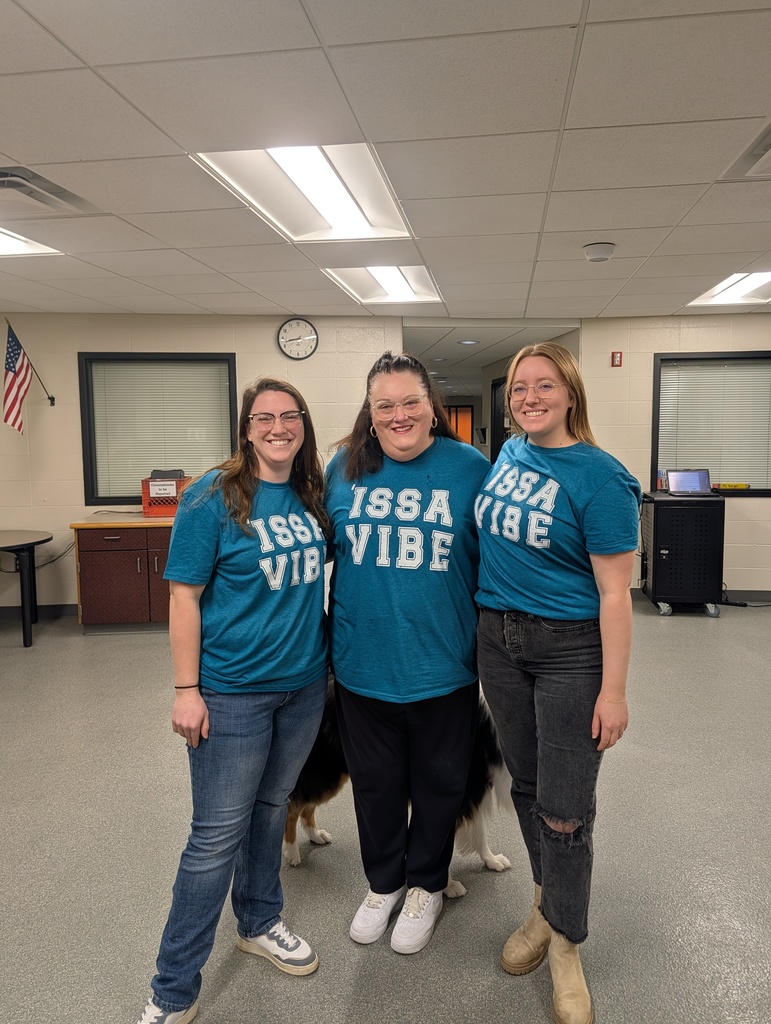 three teachers wearing matching tshirts that say Issa Vibe