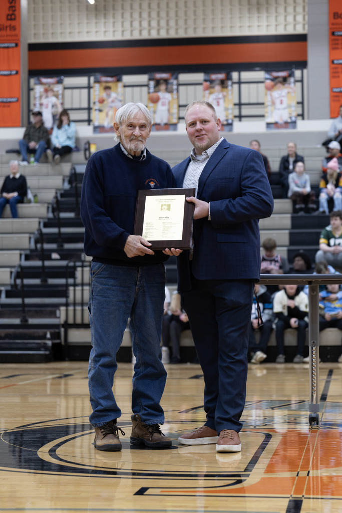 Jon and Athletic Director with award