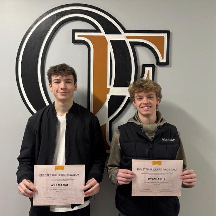 boys holding certificates 