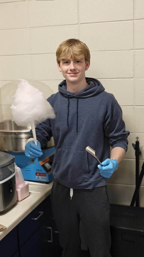 student holding cottoncandy