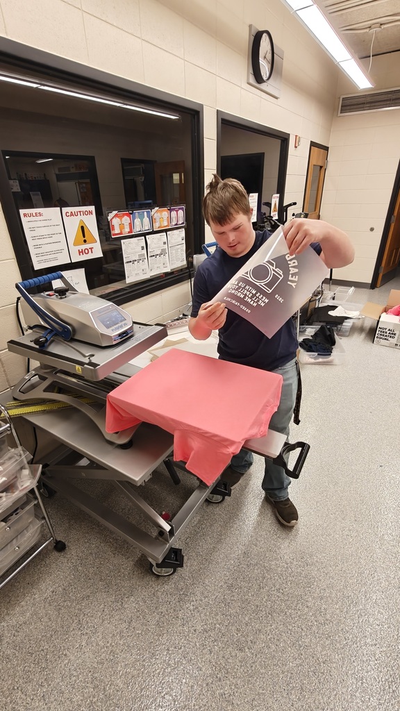 student making shirts