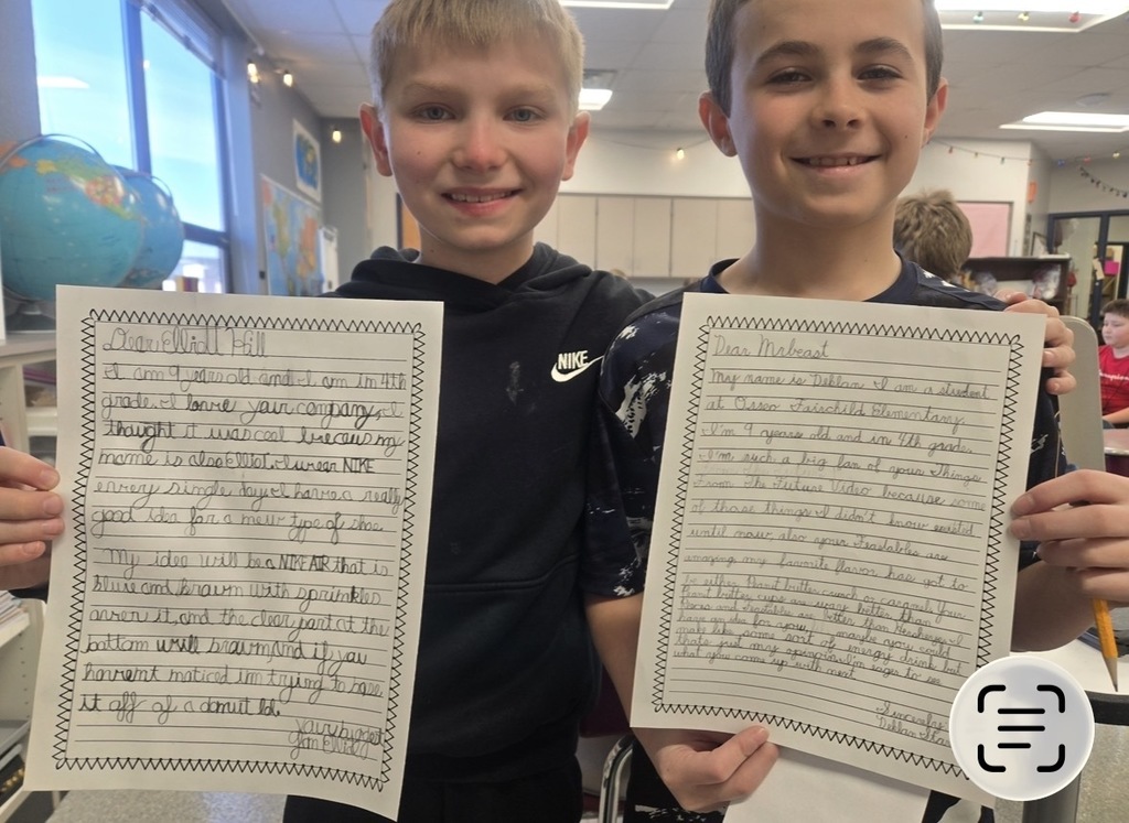 students holding letters