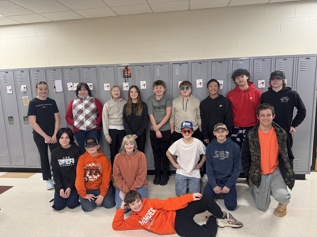 IMG_6262 (1) Middle School Students posing in front of lockers