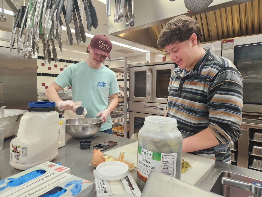 students helping in kitchen