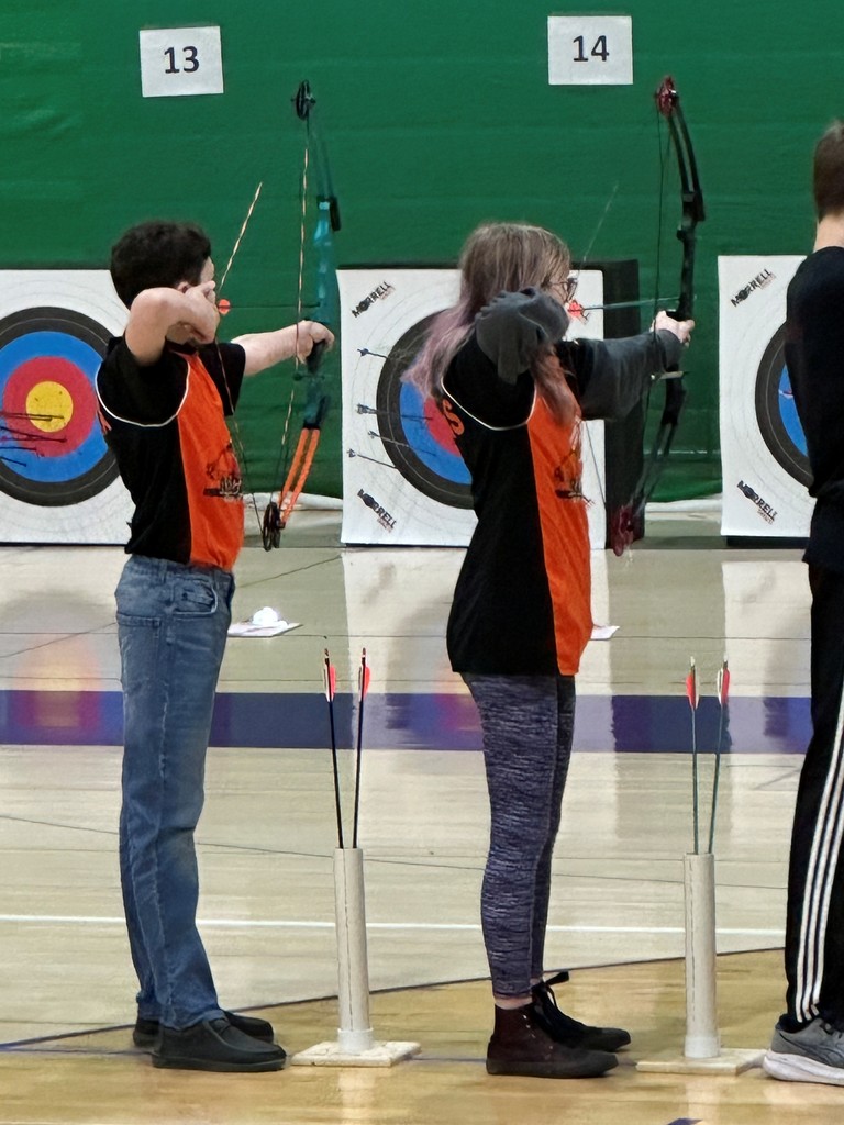 archers aiming at targets