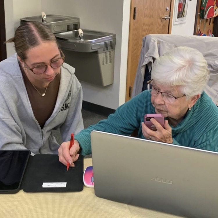 student helping senior