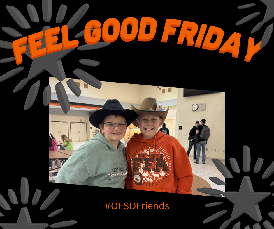 two students in cowboy hats smiling