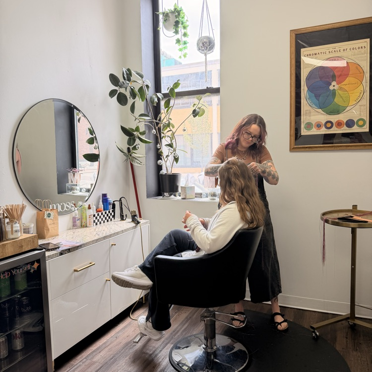 student getting hair tinsel