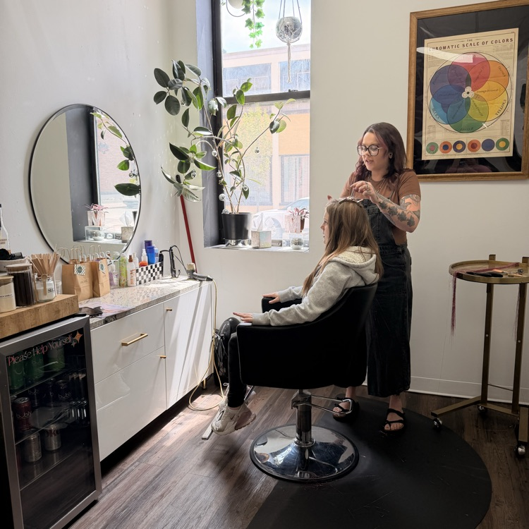 student getting hair tinsel