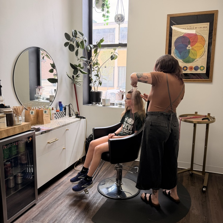 student getting hair tinsel