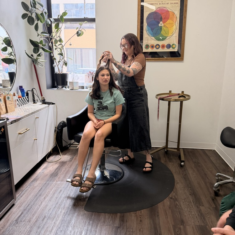 student getting hair tinsel