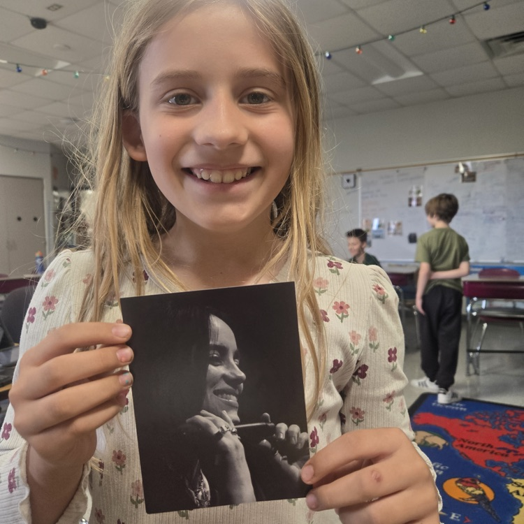 aurora holding a picture 
