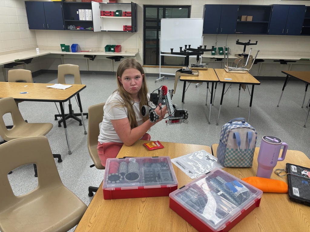 student holding vex equipment