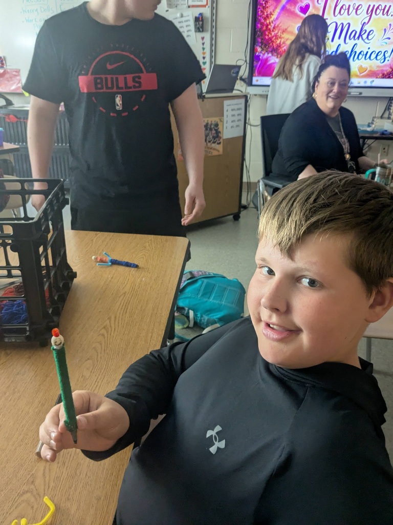 student with worry doll