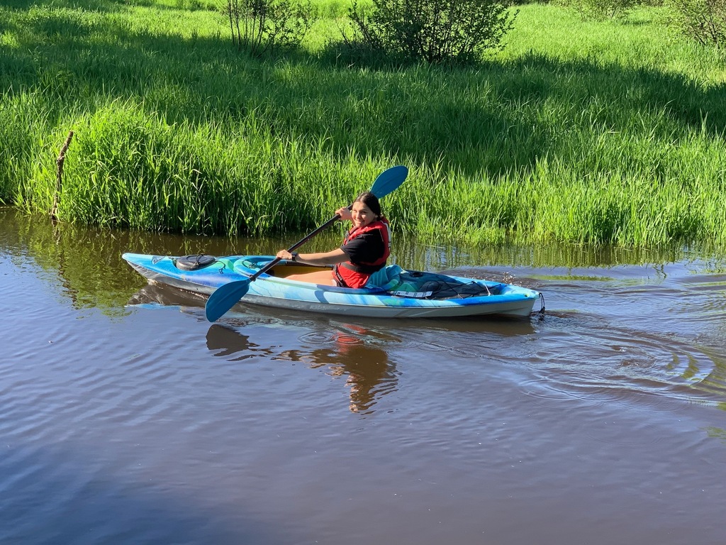 student in kayak