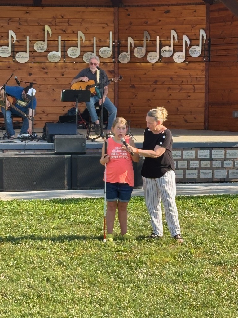Payton speaking at music in the park