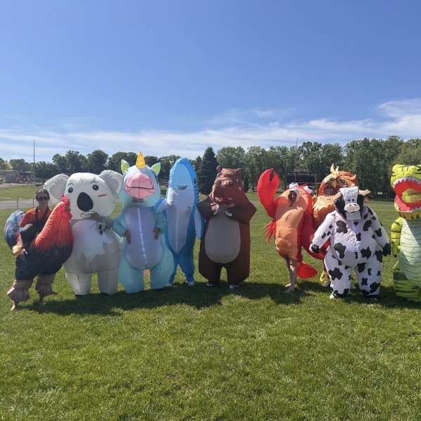 teachers wearing inflatable costumes 