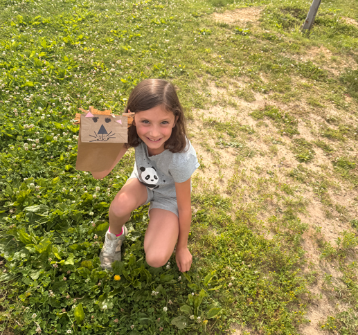 Students outside with animal puppets
