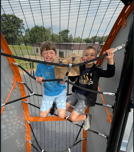 Students outside with animal puppets