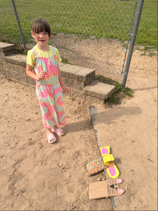 Students outside with animal puppets